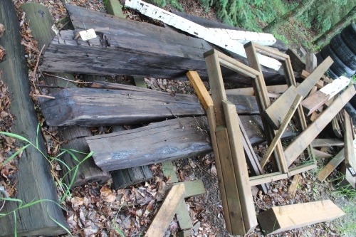 PILE OF TREATED LUMBER & TIMBERS