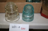 1 large clear dominion insulator, 1 blue Canadian pacific (damaged)