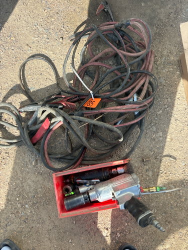 Assortment of air tools and booster cables