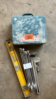 Level, pipe wrench, assorted wrenches, empty Makita tool case