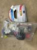 Assortment of plumbing supplies and new air hose