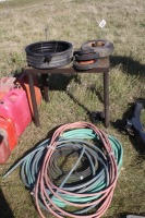 Metal stand, small tires, oil change pan, qty. Of garden hose