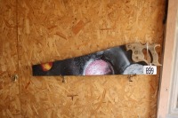 painted handsaw