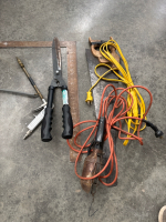 Square, extension cord, saw, blow gun, tree trimmer and trouble light