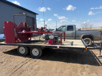 Hydraulic grain bag wrapper on rainbow trailer