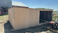 Wooden livestock shelter with metal clad roof