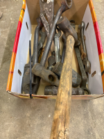 Assortment of hammer heads and wrenches