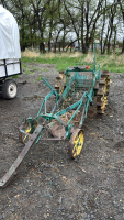 Antique potatoe digger on steel wheels