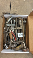 Assorted wrenches and hand toys
