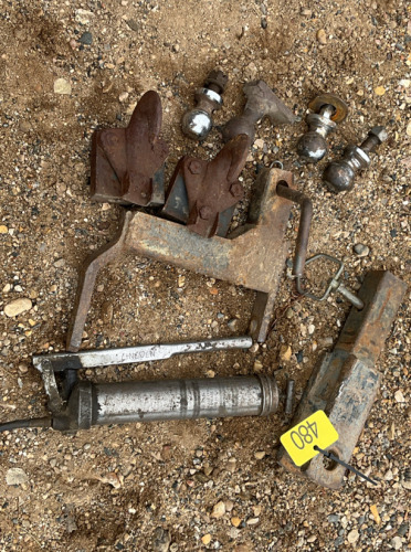Assorted hitches, balls and grease gun