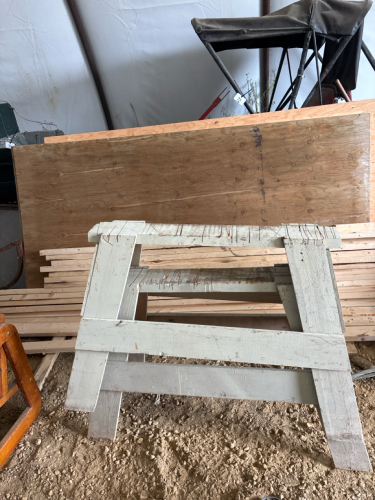 Assortment of plywood, 2x4 lumber, & 2 saw horses