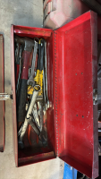 Toolbox containing assorted flat wrenches, pipe wrench, hammer