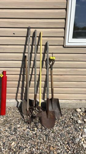 Assorted shovels and yard tools