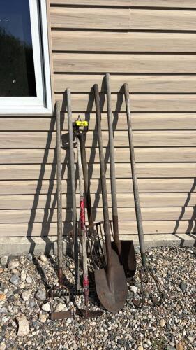 Assorted spades and yard tools