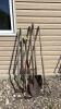 Assorted spades and yard tools
