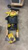 2 dollys, battery charger, chainsaw, DeWalt drill with battery and charger