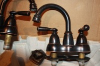 2 - Used Moen bathroom taps w/ pop up drains, 4" centers ($100 reserve)