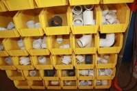 Large quantity of fittings w/ 60 bins & heavy duty stand