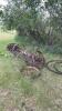 Assortment of antique axles and steel wheels