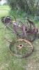 Assortment of antique axles and steel wheels - 2