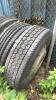 9- misc tires all have rims but one - 4
