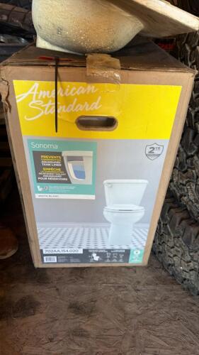 American standard toilet new in box and sink