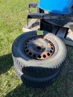 Two 195/60 r15 studded winter tires on steel rims
