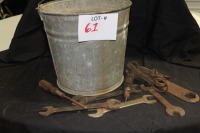 pail of antique wrenches
