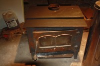 Warhock Hersey woodstove w/ 16' of selkirk chimney, T adapter, insulated, top cap