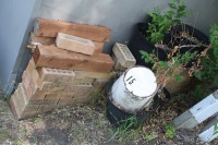 3 - 4" x 4" posts, garden pots, bricks