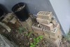 3 - 4" x 4" posts, garden pots, bricks - 2