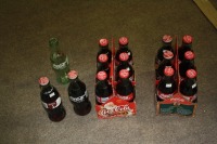 14 - 237 ml. Full coke bottles, 1 empty coke bottle