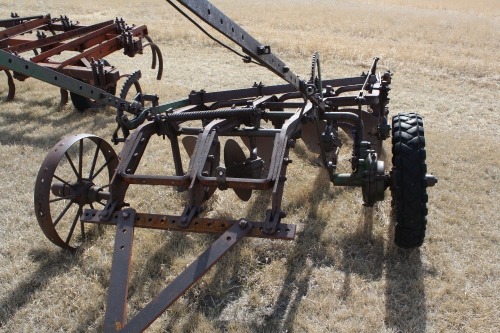 4 furrow plow w/ steel wheels